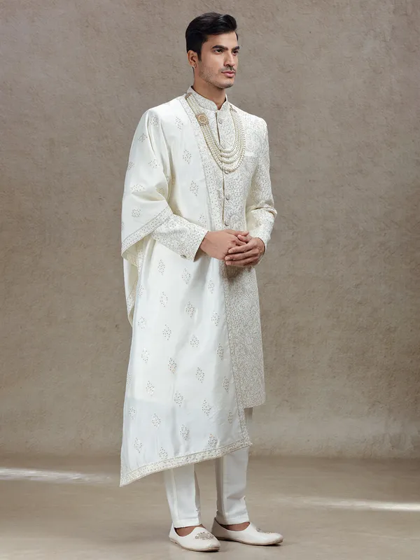 Ivory cream silk sherwani with rich embellishments