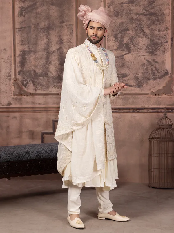 Latest silk sherwani with embroidery in cream