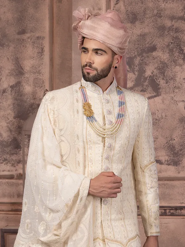 Latest silk sherwani with embroidery in cream