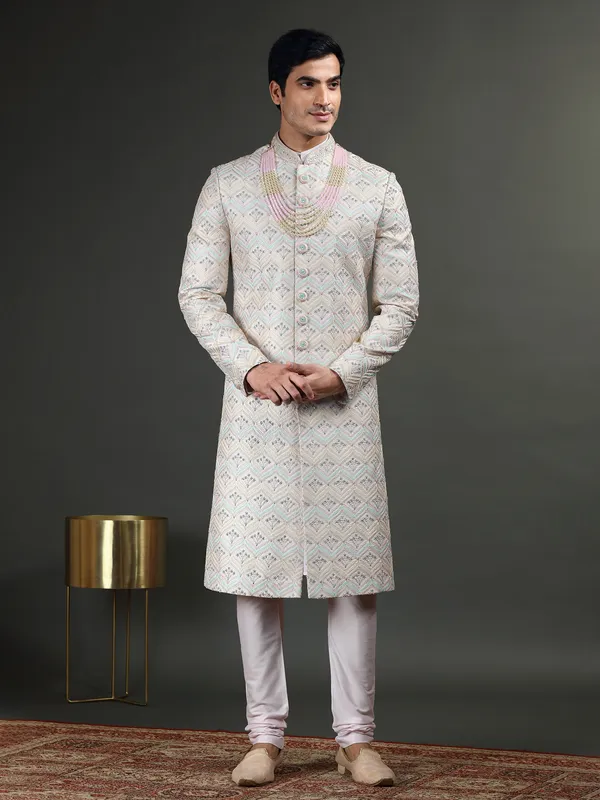 Lavish light pink raw silk sherwani