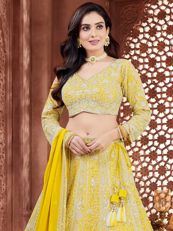 Lemon Yellow georgette lehenga choli with resham work