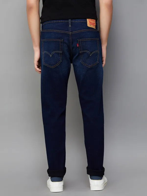 LEVIS washed dark blue slim taper fit denim