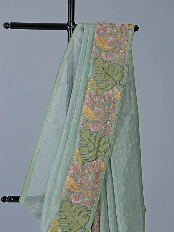 Light blue organza saree with unstitched blouse