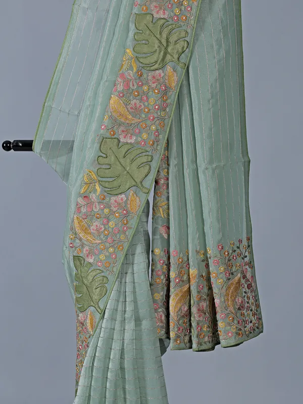 Light blue organza saree with unstitched blouse