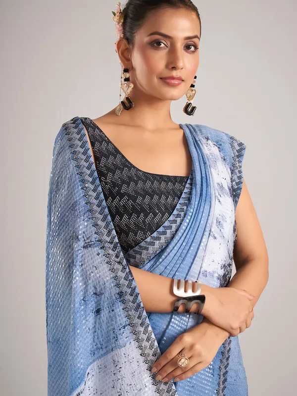 Light blue party wear saree with sequins weaving