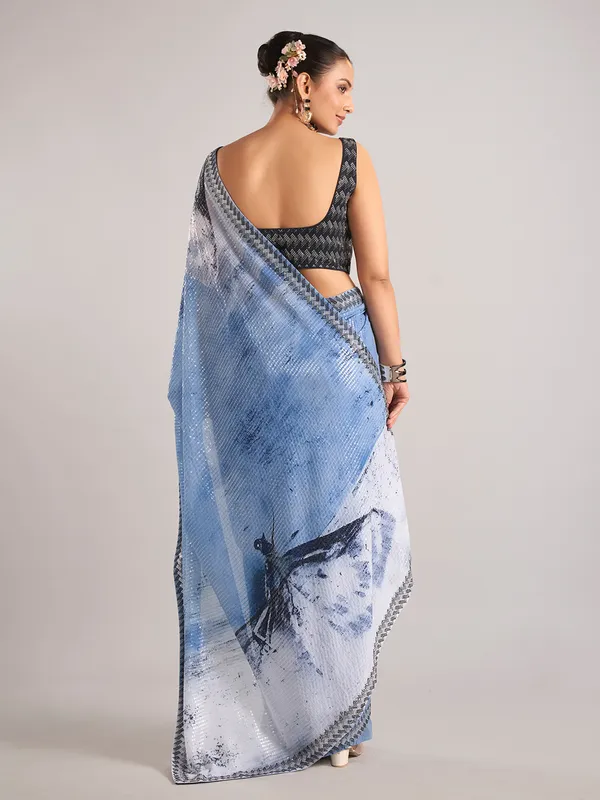 Light blue party wear saree with sequins weaving