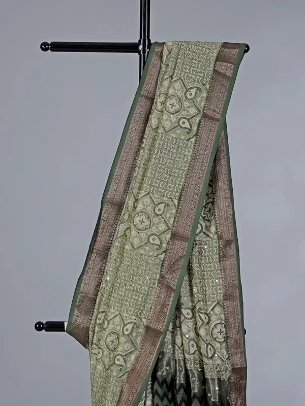 Light green cotton saree with mirror ornamentation