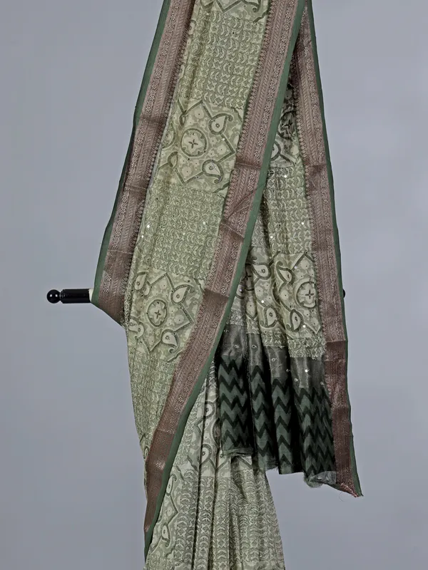 Light green cotton saree with mirror ornamentation