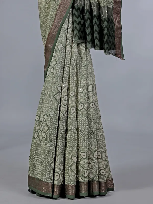 Light green cotton saree with mirror ornamentation