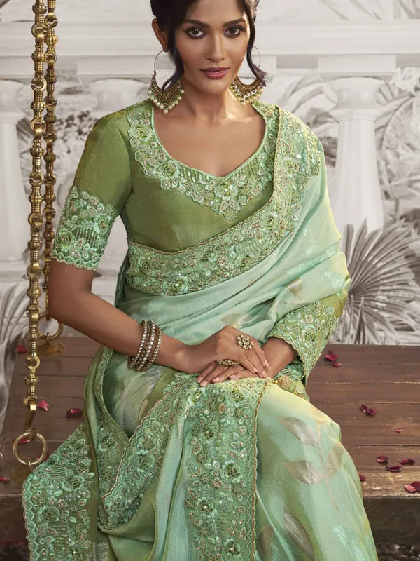 Light green festive wear silk saree with embroidery