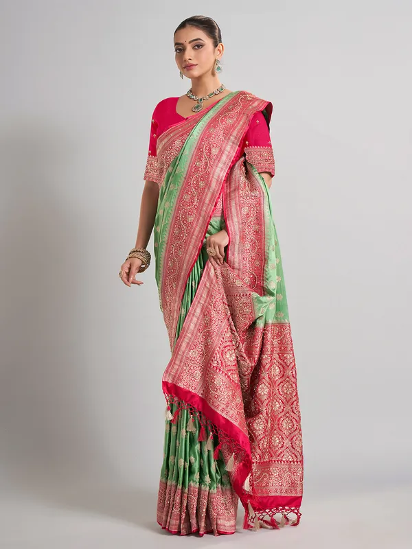 Light green satin silk saree with contrast border detailing