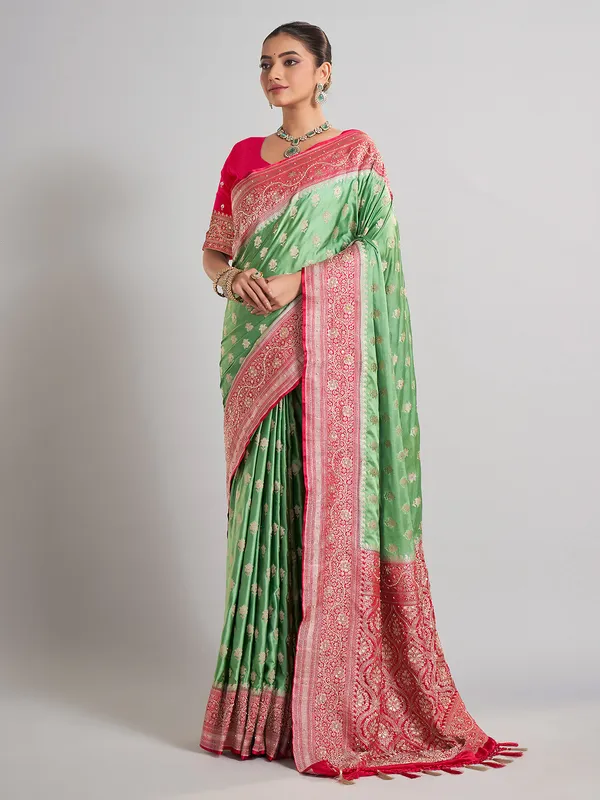 Light green satin silk saree with contrast border detailing