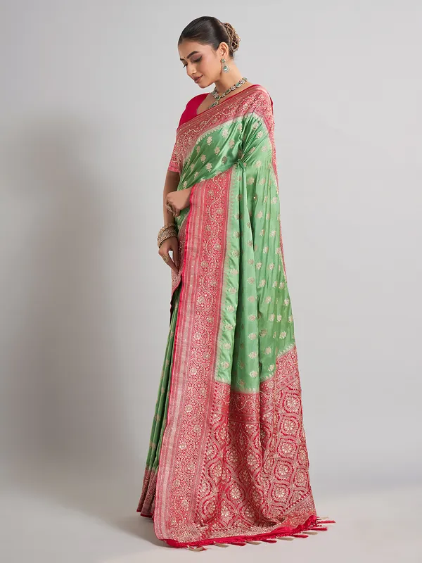 Light green satin silk saree with contrast border detailing