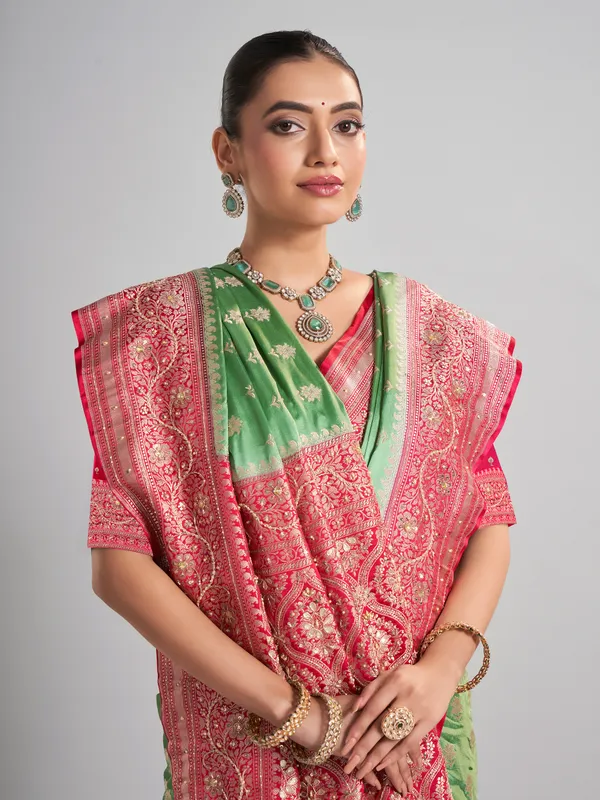 Light green satin silk saree with contrast border detailing