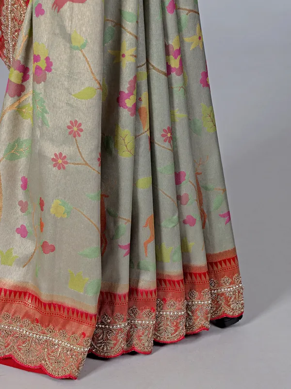 Light grey kanjivaram silk saree with colorful motifs