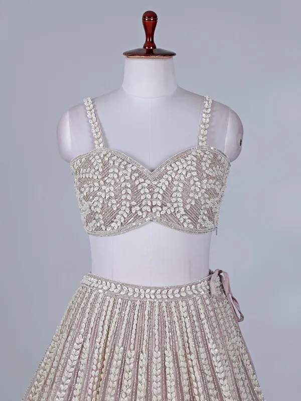 Light pink net lehenga choli for wedding celebration