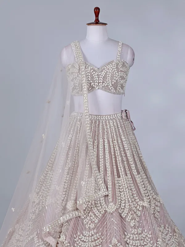Light pink net lehenga choli for wedding celebration