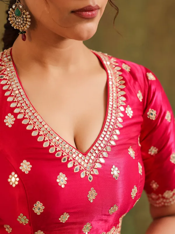 Light pink silk saree with red accents wedding wear