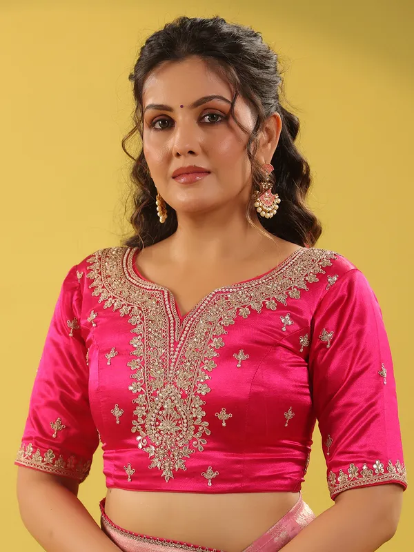 Light pink silk saree with zari embellishments for wedding wear