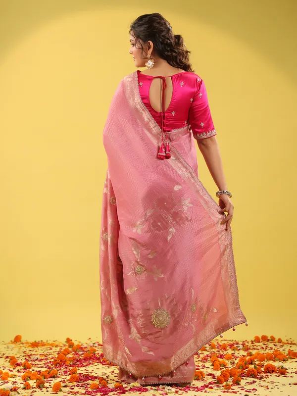 Light pink silk saree with zari embellishments for wedding wear
