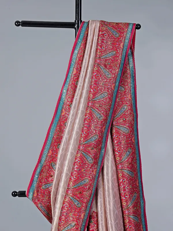 Light pink tissue silk saree with colorful motifs
