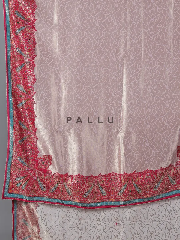 Light pink tissue silk saree with colorful motifs
