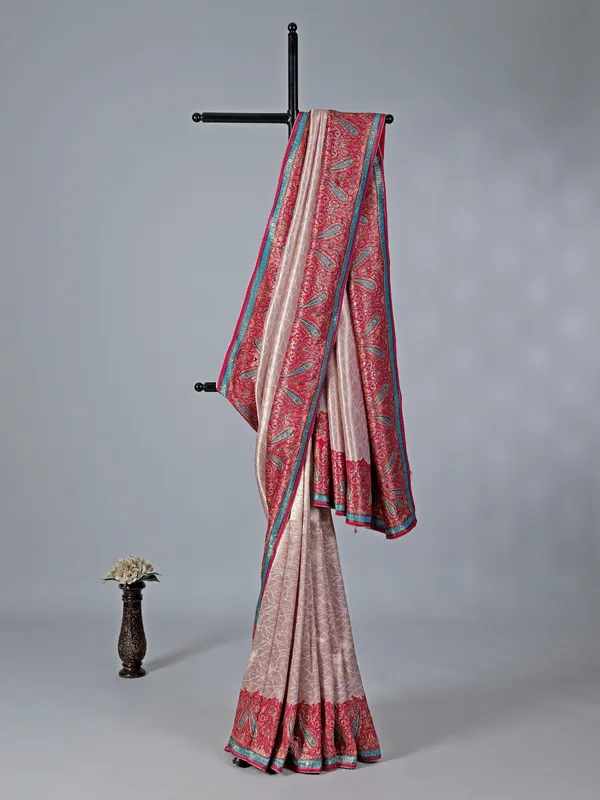 Light pink tissue silk saree with colorful motifs