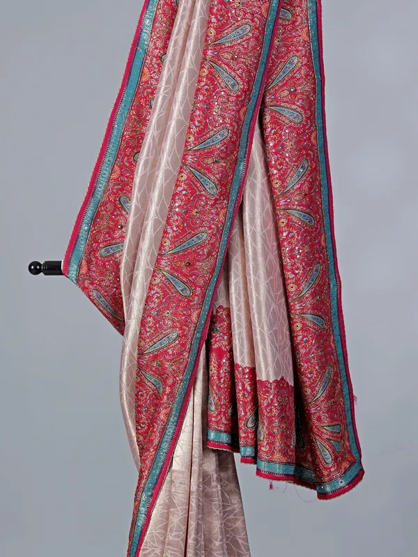 Light pink tissue silk saree with colorful motifs
