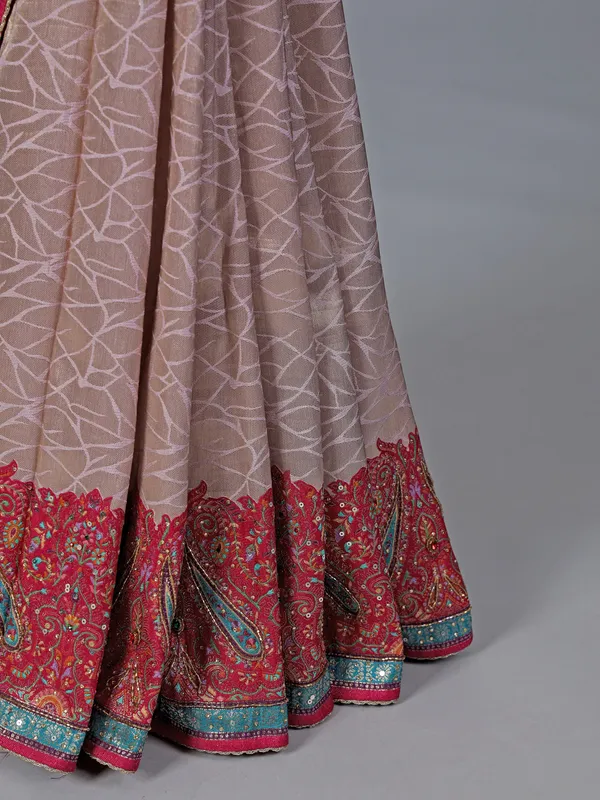 Light pink tissue silk saree with colorful motifs