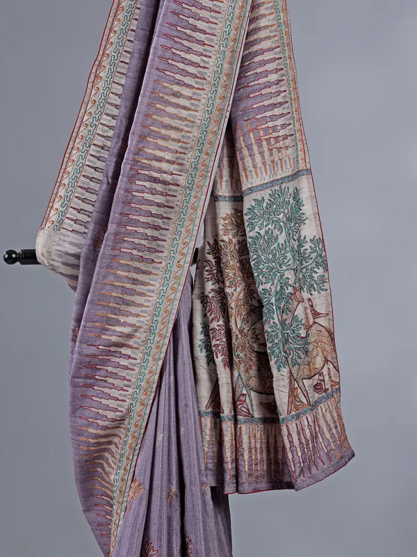 Light purple silk saree featuring traditional thread weaving