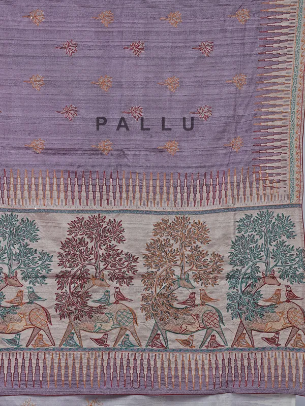 Light purple silk saree featuring traditional thread weaving