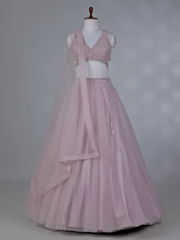 Lilac net lehenga choli with stone work