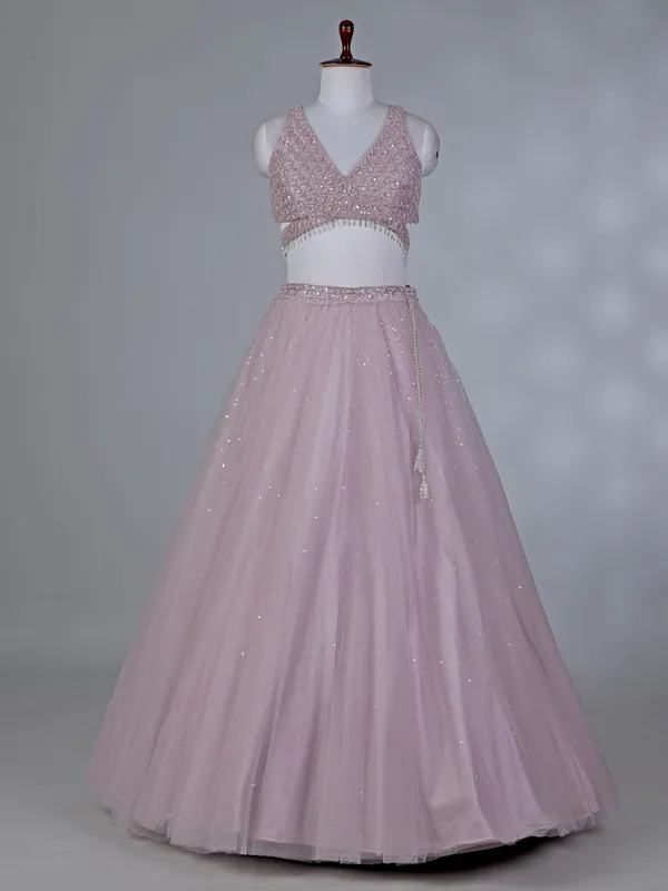 Lilac net lehenga choli with stone work