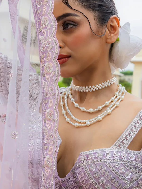 Lilac purple thread worked net lehenga choli