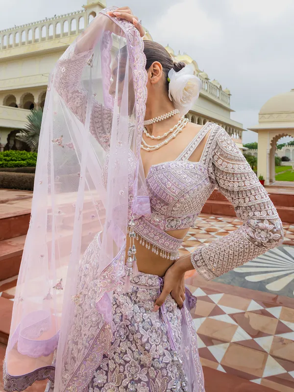 Lilac purple thread worked net lehenga choli