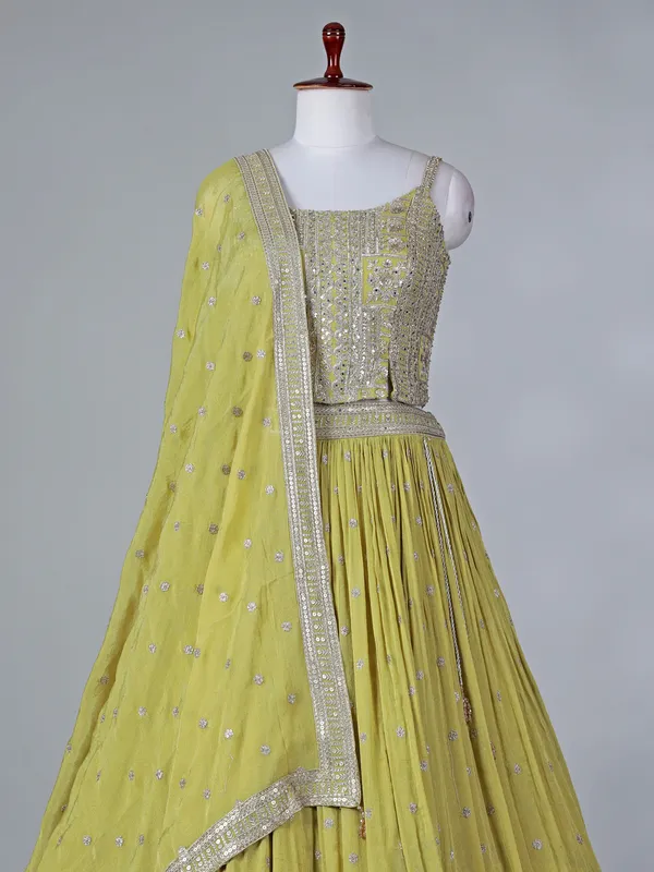 Lime green silk lehenga choli with mirror work