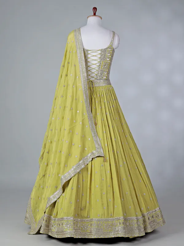 Lime green silk lehenga choli with mirror work