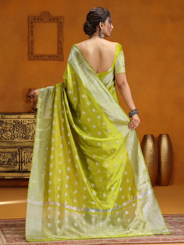 Lime green silk saree with silver zari weaving