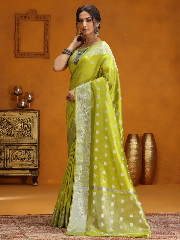 Lime green silk saree with silver zari weaving