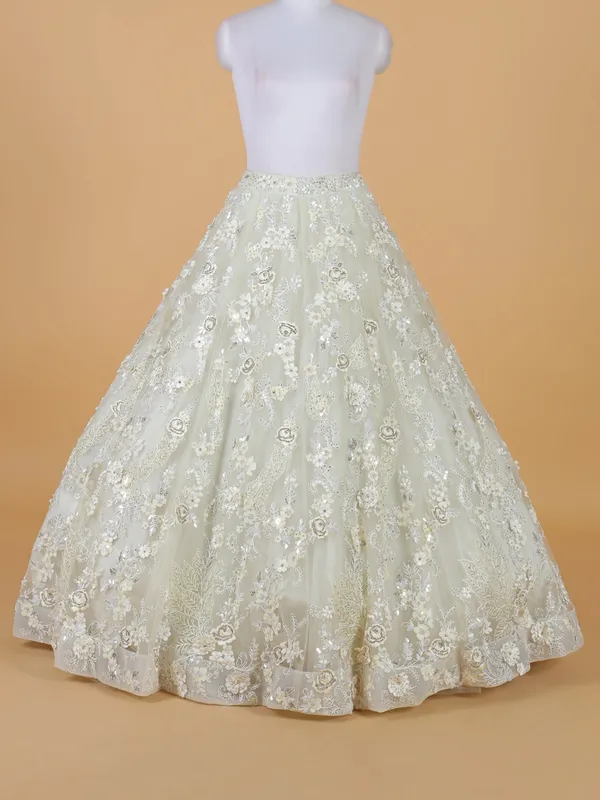 Luxurious looking off white net lehenga choli