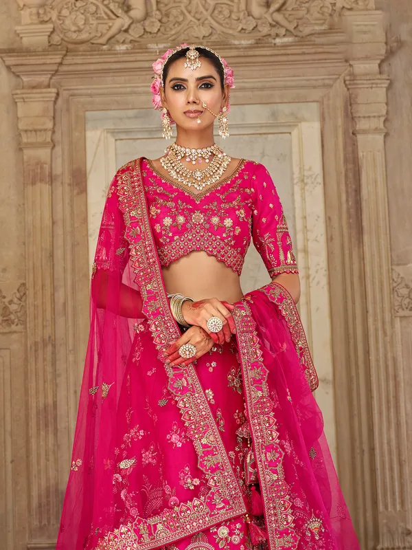 Magenta bridal silk lehenga choli with resham and sequins detailing