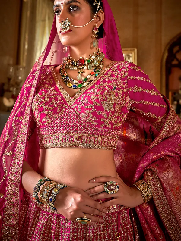 Magenta bridal silk lehenga choli with two dupatta