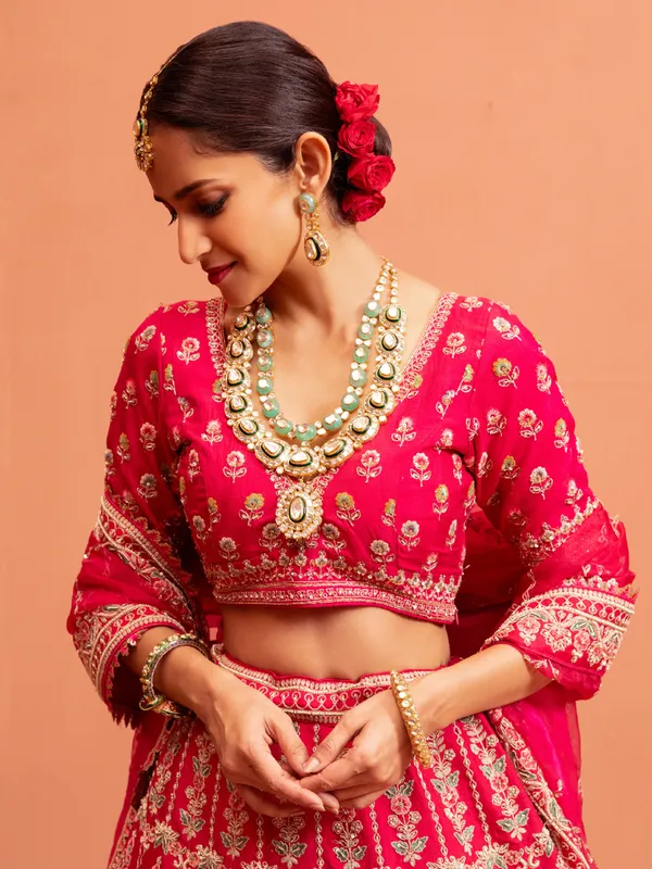 Magenta raw silk bridal lehenga choli with embellishments