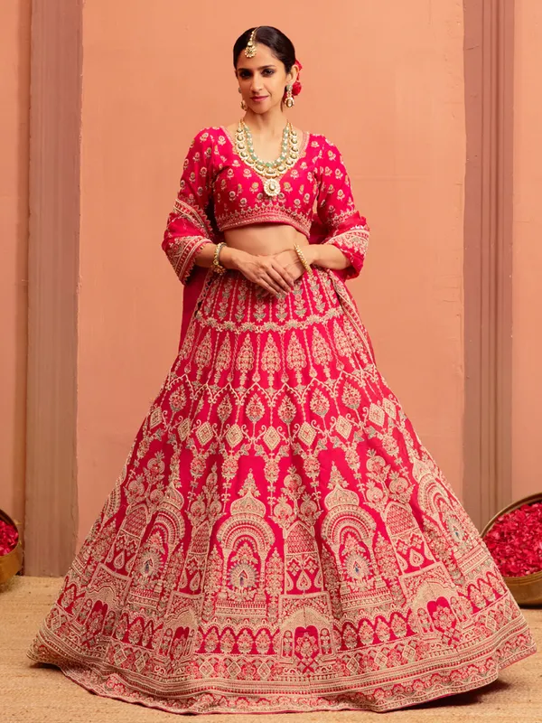 Magenta raw silk bridal lehenga choli with embellishments