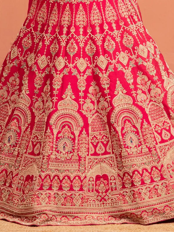 Magenta raw silk bridal lehenga choli with embellishments