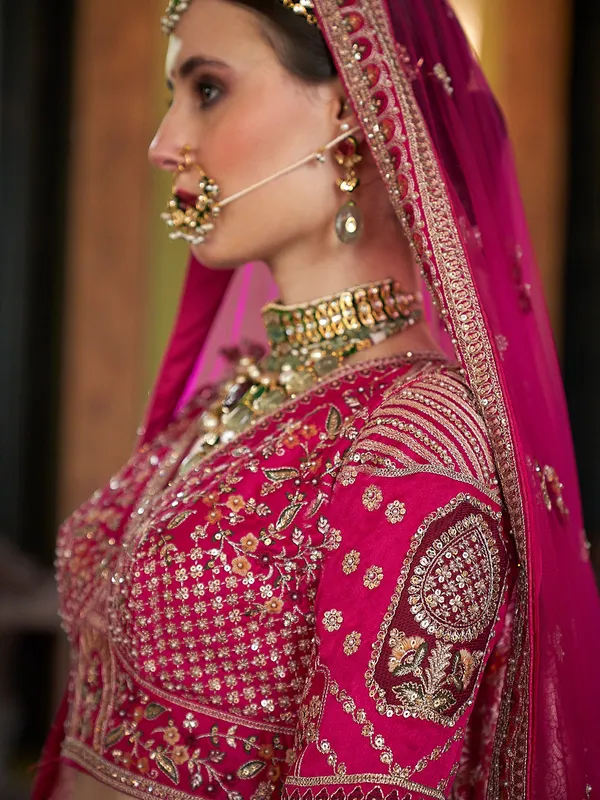 Magenta silk bridal lehenga choli with sequins work