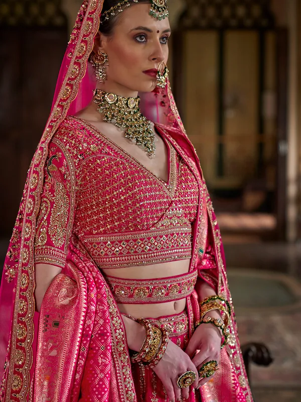 Magenta silk bridal lehenga choli with rich sewuins work