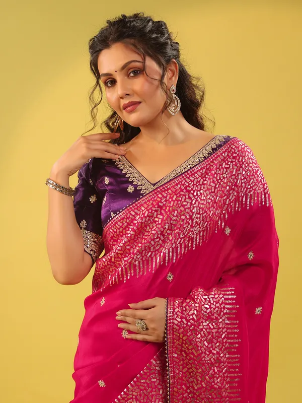Magenta silk saree with purple blouse for wedding
