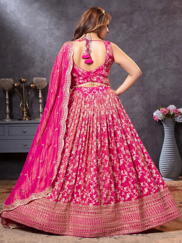 Magenta tissue silk lehenga choli with intricate zari