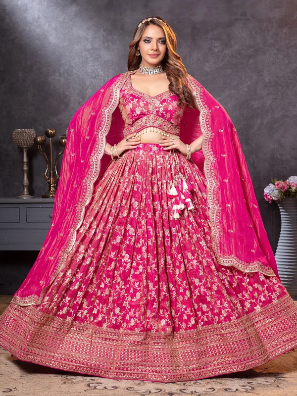 Magenta tissue silk lehenga choli with intricate zari